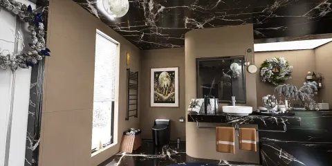 luxurious bathroom design featuring dark marble walls and ceiling, modern sink installation, showcasing a sophisticated and elegant style, enhancing the overall spa-like experience using Homestyler's real-time 3D rendering feature.