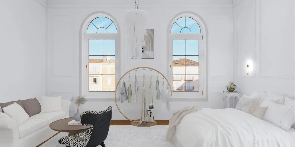 a white bed sitting in a room next to a window 