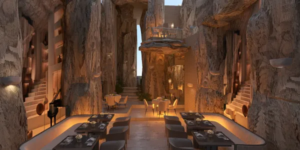 Stylish dining area featuring textured stone walls and elegant table settings in a modern cave-inspired design, showcasing a unique interior decor ambiance, utilizing Homestyler's real-time 3D rendering feature to preview the design.