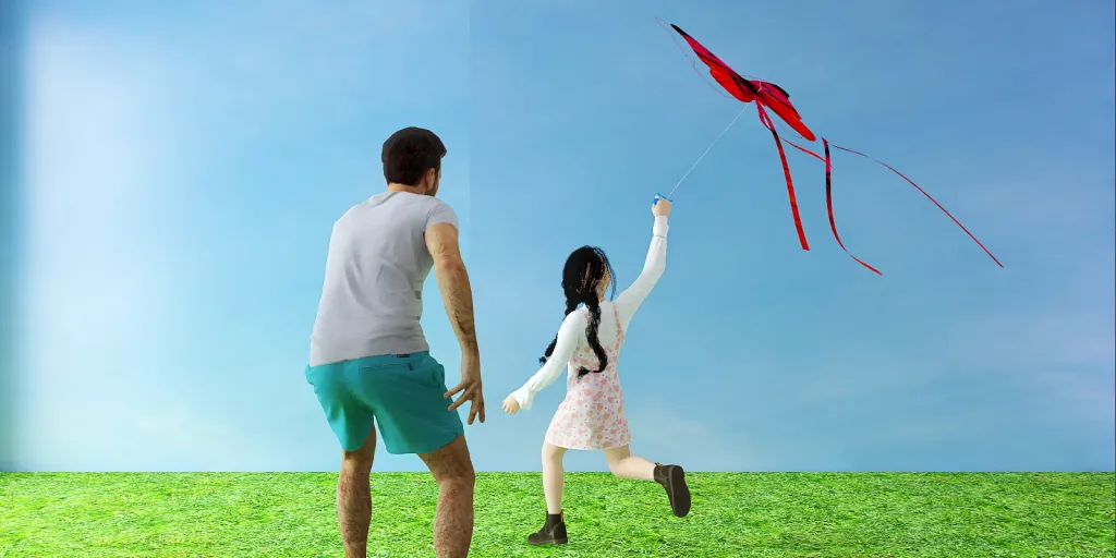 a man and a woman flying a kite together 
