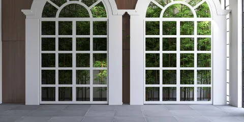 large windows with grid patterns showcasing a vibrant green outdoor view, enhancing natural light in a modern interior space, featuring Homestyler's real-time 3D rendering for design proposal display.