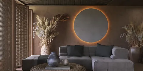 cozy living room with modern sectional sofa and circular wall light, featuring natural elements and warm tones, showcasing interior decor design options with Homestyler's real-time 3D rendering.