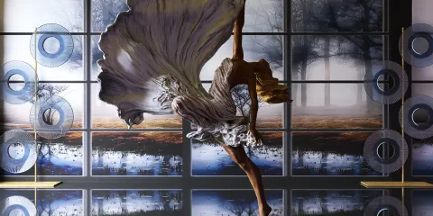 a dancer performing an elegant pose in a contemporary interior space featuring artistic wall panels and decorative elements, showcasing interior design aesthetics; highlights Homestyler's real-time 3D rendering feature for visualizing design concepts.