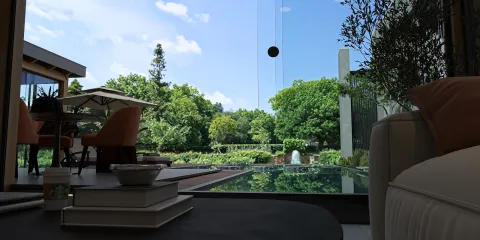 modern living room with a stunning outdoor view featuring a pool and lush greenery, designed using Homestyler's real-time 3D rendering for immersive interior decoration.