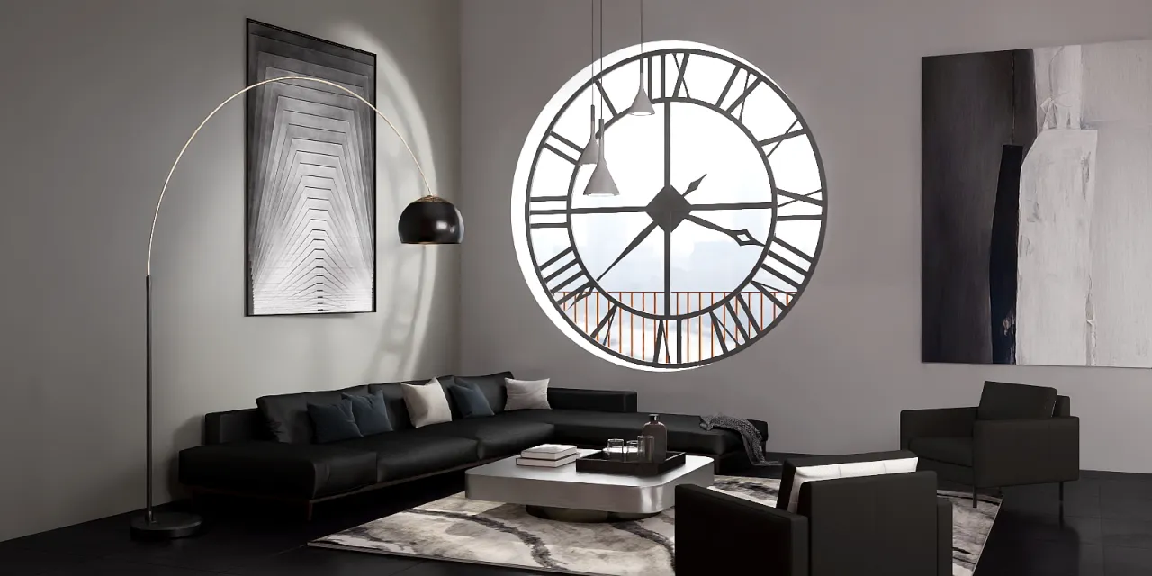 a large white clock sitting on top of a wooden table 