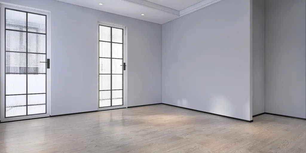 a room with a white wall and a black floor 