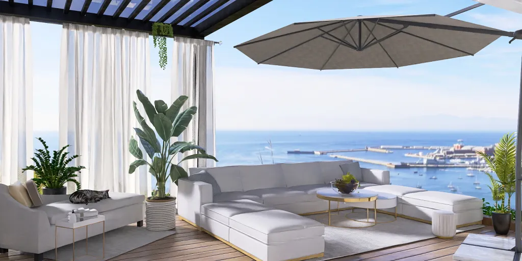 a white couch sitting under a balcony overlooking a beach 