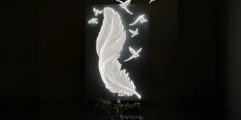 decorative wall art featuring a feather with flying birds design, enhancing artistic ambiance in a living room using Homestyler's 3D rendering feature