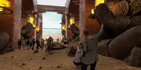 Visitors exploring a surreal environment with giant stone hands and lanterns, creating an immersive atmosphere that blends fantasy and reality, emphasizing the interior design concept of enhanced visitor interactions using Homestyler's AR virtual furniture placement.