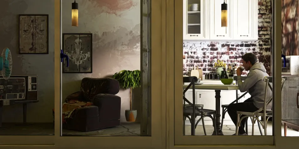 cozy living room and dining area featuring a person enjoying a meal in a modern farmhouse style with emphasis on comfort and warmth using Homestyler's intelligent furniture arrangement