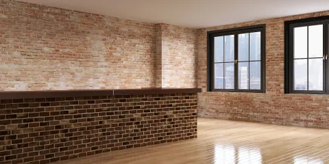 exposed brick wall with a wooden counter in a spacious interior setting showcasing natural light and warm wood flooring using Homestyler's real-time 3D rendering feature for interior design.