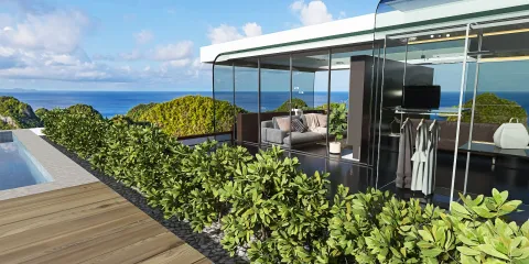 modern outdoor lounge area featuring glass walls and lush greenery overlooking the ocean, showcasing an open living space design with Homestyler's real-time 3D rendering feature.