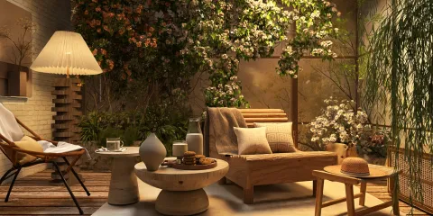 cozy outdoor seating area featuring a modern wooden chair and table arrangement with soft cushions surrounded by greenery and floral decorations, showcasing a serene and inviting atmosphere for relaxation, utilizing Homestyler's real-time 3D rendering for design preview.